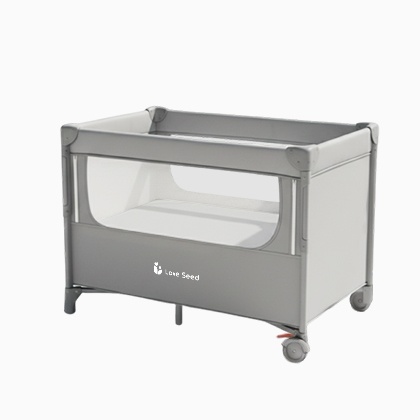 Light gray baby bedside crib